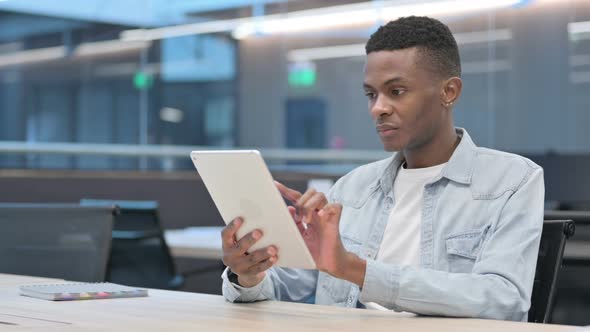 African Man using Tablet in Office