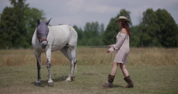 Woman Riding Horse on Farm. Recreation - Woman Walking with Horse