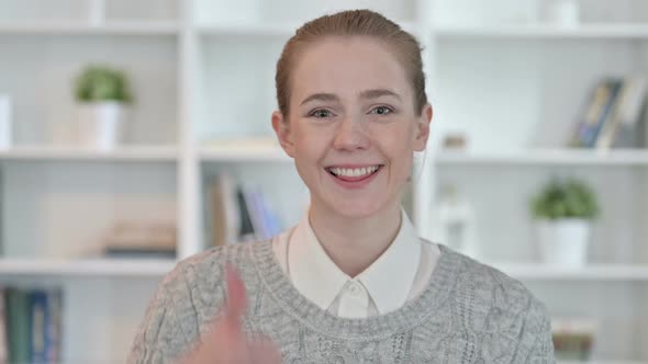 Portrait of Positive Young Woman Doing Thumbs Up