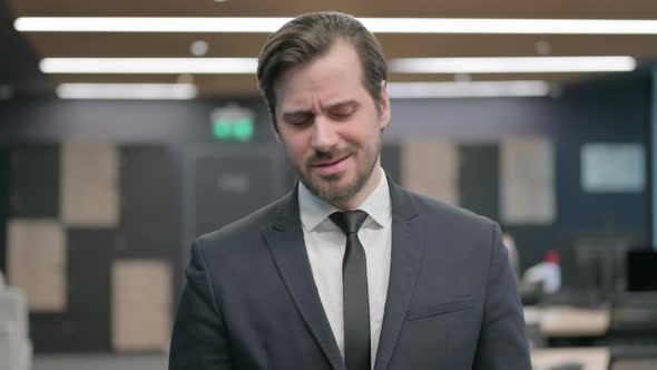 Portrait of Disappointed Businessman Feeling Upset Crying