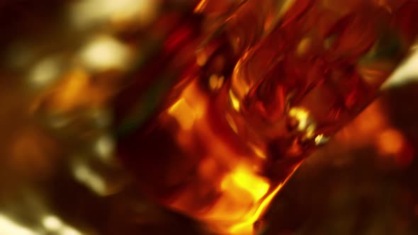 Super Slow Motion Macro Shot of Pouring Alcohol Liquid at 1000Fps.