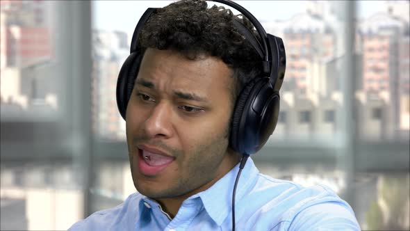 Close Up Portrait Arabic Man Enjoying Music in Headphones