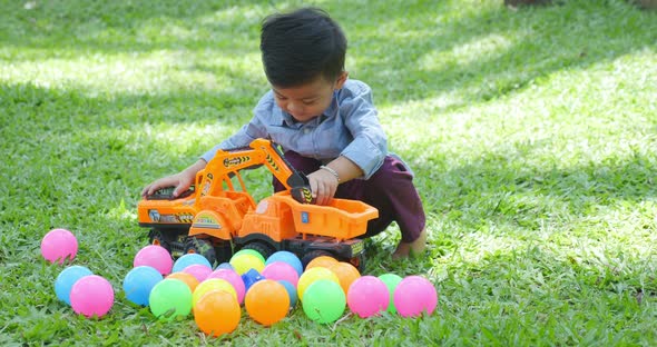 Little Boy Plays With Toys