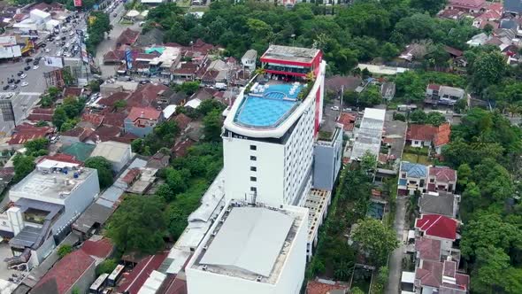 Aerial pan of Indoluxe Hotel with rooftop pool, Yogyakarta, Indonesia