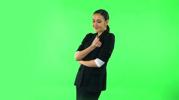 Cute Girl Smiles and Showing Heart with Fingers Then Blowing Kiss. Green Screen