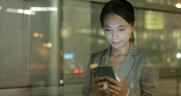 Woman looking at mobile phone in Hong Kong 