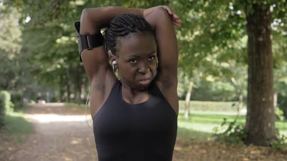 attractive young african athlete doing stretching- sport,health,run