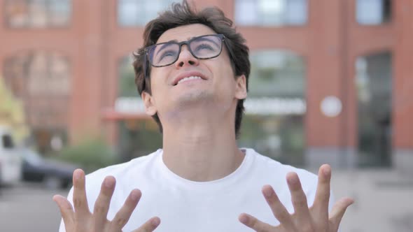 Outdoor Portrait of Young Man Upset by Results