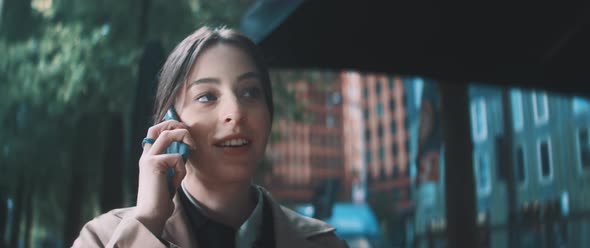 Young business woman talking on phone and smiling