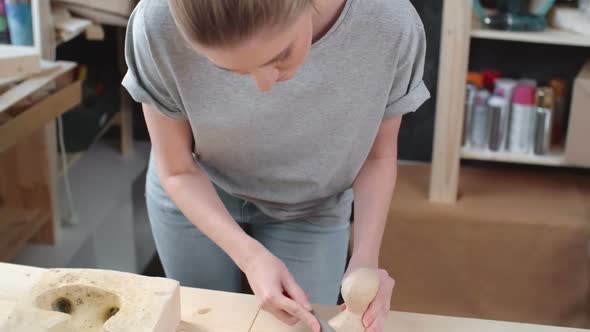 Craftswoman Making Paper Dog Toy