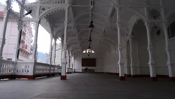 Walking in Market Colonnade, Karlovy Vary, Czech Republic. Old White Building in Downtown, City Land