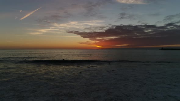 Surfers on The Sea Sunset