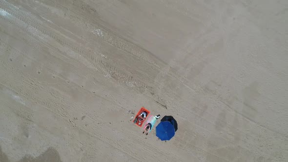 Aerial view of beach and parasol