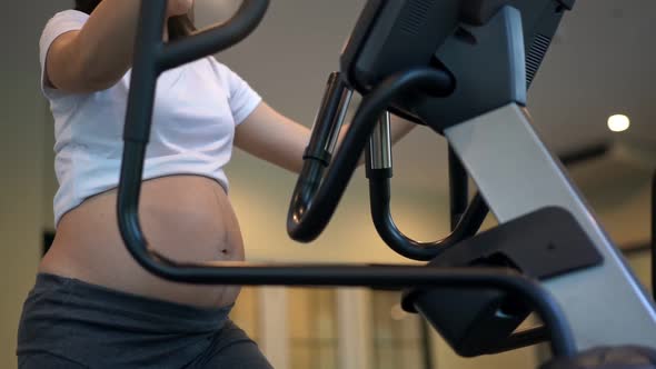 Active Pregnant Woman Exercise in Fitness Center