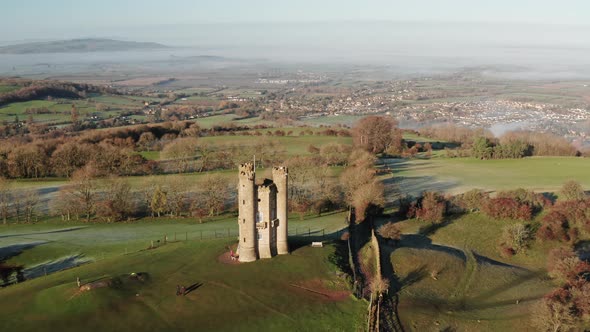 Aerial drone video of Broadway Tower, a famous iconic tourist attraction in The Cotswolds Hills, ico