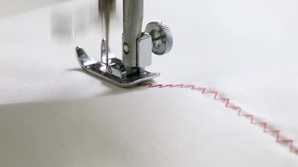 Sewing Machine Needle in Motion., close-up of sewing machine needle rapidly moves up and down 