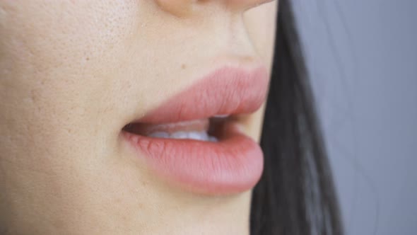 Close Up Woman Mouth with Plump Lips and Perfect White Teeth Talking