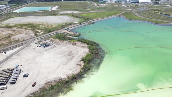 orbiting aerial of a large phosphate pool in Piney Point, Florida (Palmetto)