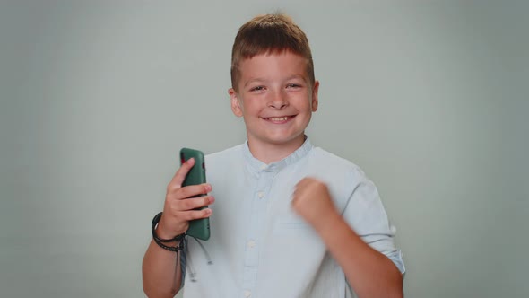 Happy Excited Boy Use Mobile Phone Say Wow Yes Found Out Great Big Win News Doing Winner Gesture