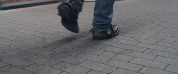 Cowboy walking in a stable