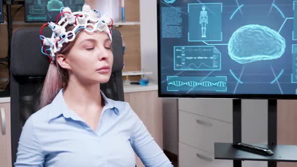 Female Patient Keeping Her Eyes Closed in a Brain Research Centre