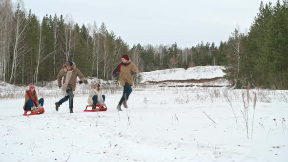 Young Couples Tobogganing