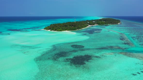 Beautiful overhead travel shot of a sunshine white sandy paradise beach and blue sea background in c