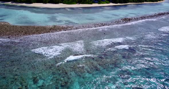 Luxury drone copy space shot of a white sand paradise beach and blue water background