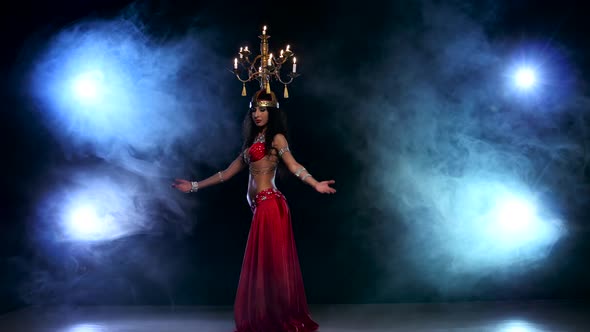 Attractive Slim Belly Dancer Go on Dancing with Candles, Her Head, Black, Smoke