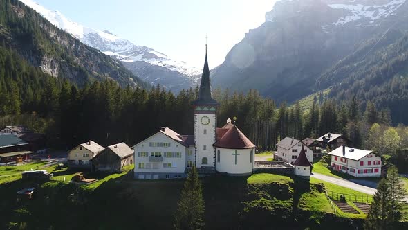 Aerial video of a church in a villiage along the Klausen Pass in Switzerland.