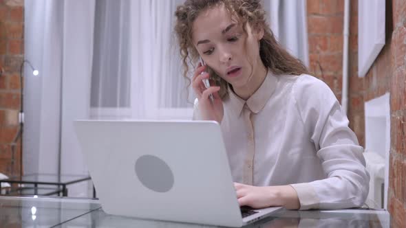 Female Talking on Phone Attending Phone Call