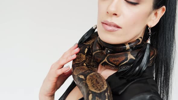 Close Up View Footage of the Snake's Head on a Woman's Hands