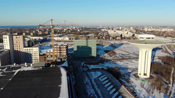 Drone flying over Hyllie towards Turning torso, Wintertime, Malmö Sweden