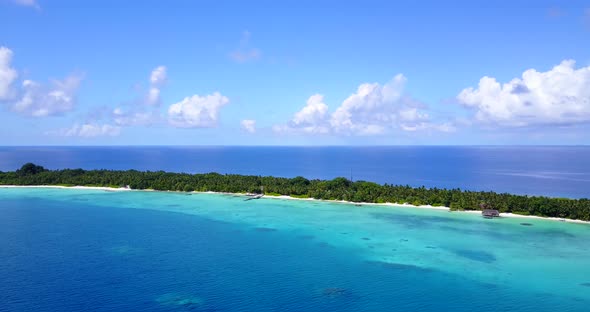 Wide angle aerial copy space shot of a white paradise beach and blue sea background in best quality 