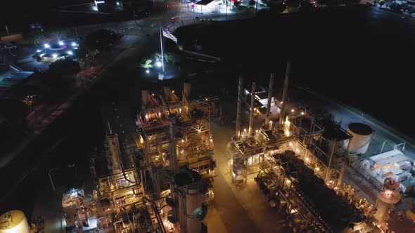 Huge Petroleum Refinery During Its Work at Night. Brightly Illuminated Plant Structures. USA alt