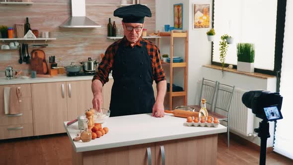 Man Recording a Culinary Video Blog