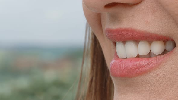 Smile of a Charming Girl with Perfect White Teeth Close Up Which Is Turned Sideways To the Camera