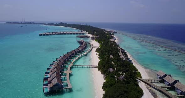 Tropical drone clean view of a paradise sunny white sand beach and blue ocean background in colorful