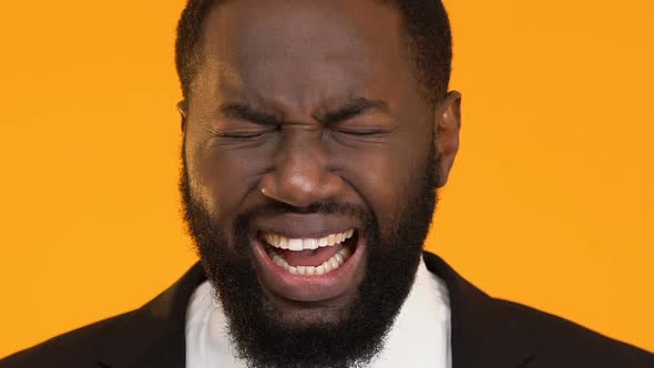 Black Man in Suit Massaging Temples, Suffering From Migraine Pain, Job Stress