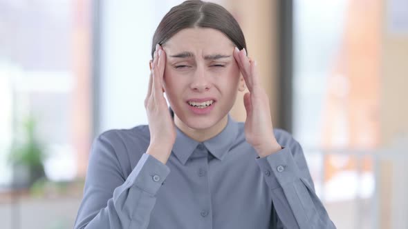 Portrait of Young Latin Woman Having Headache