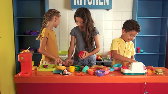 Kids Cooking the Hamburger in the Toy Kitchen