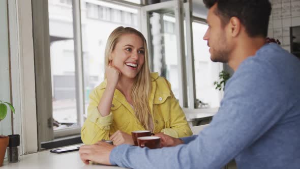 Caucasian couple enjoying at coffee shop