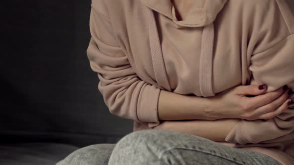 Woman Writhes with Abdominal Pain Menstrual Pain Risk of Miscarriage Inflammation of the Appendix