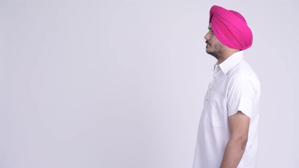 Profile View of Bearded Indian Sikh Man Wearing Turban