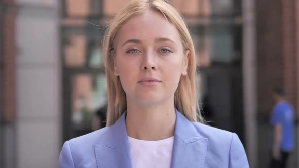 Outdoor Portrait of Young Businesswoman