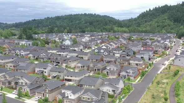 Aerial flying close to houses in an American middle class subdivision.