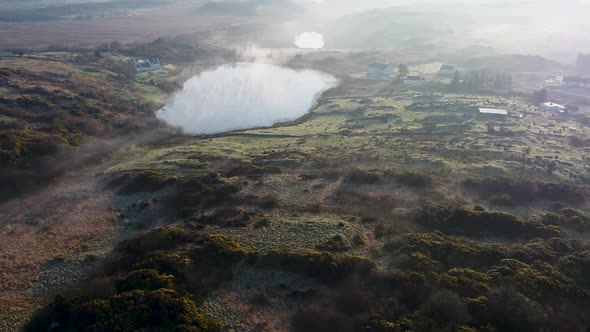 Aerial View of Bonny Glen in County Donegal with Fog  Ireland
