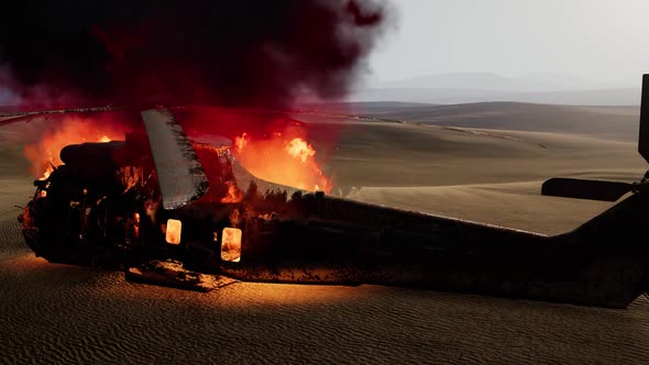 Burned Military Helicopter in the Desert at Sunset