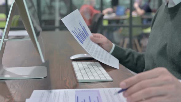 Close Up Shoot of Man Hand Writing and Checking the Documents