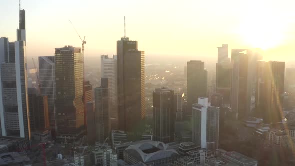 AERIAL: View of Frankfurt Am Main, Germany Skyline with Sunflair Between Skyscrapers in Beautiful